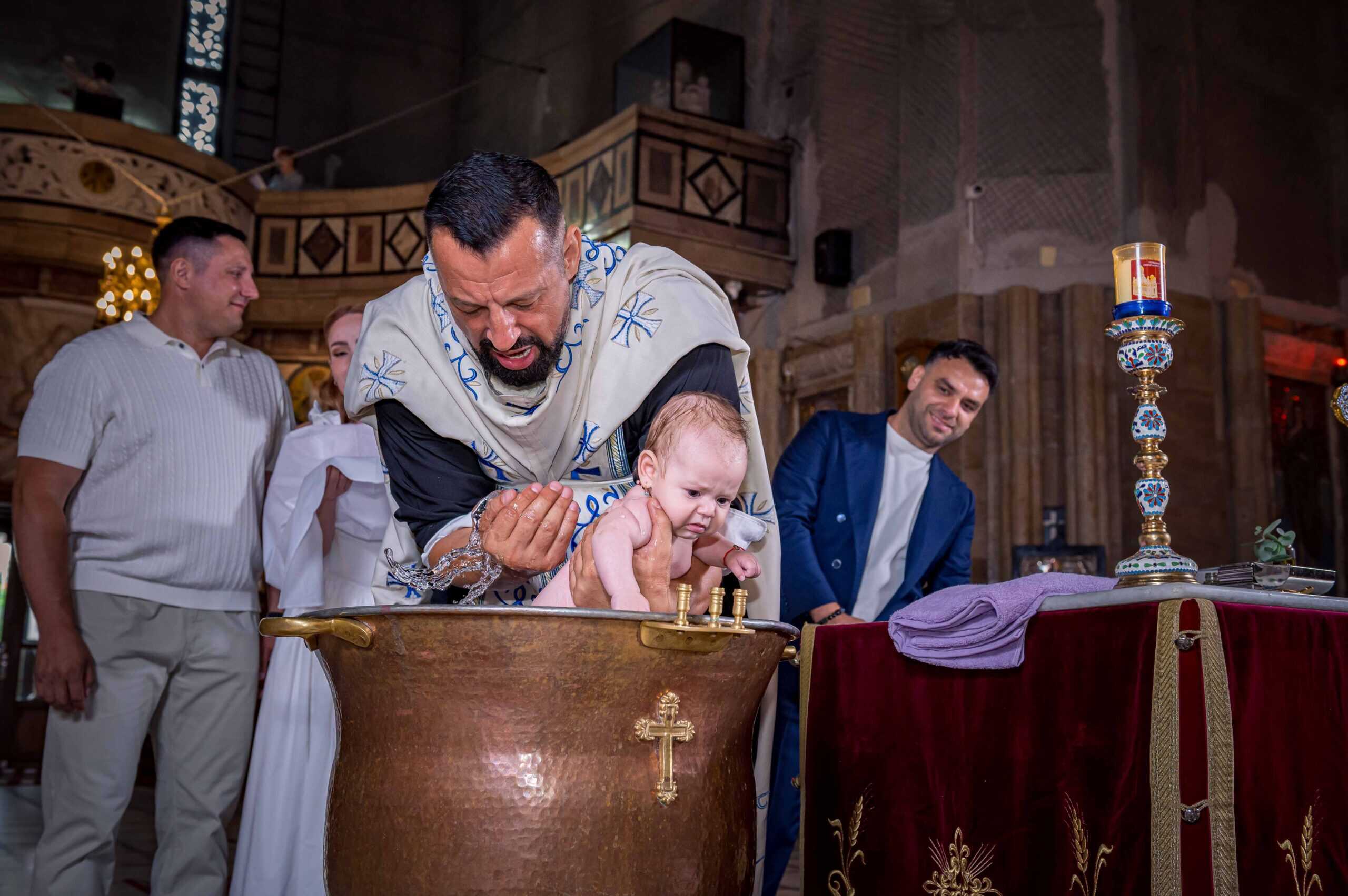 MGA Photos logo with a baptism scene at a church.